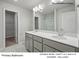 Primary bathroom featuring a double bowl vanity, a large mirror, and a 5' walk in shower at 213 Lake George Dr, Shelby, NC 28152