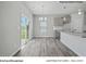 Bright breakfast area with sliding glass doors and adjacent kitchen area at 213 Lake George Dr, Shelby, NC 28152