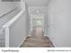 Bright entryway with wood flooring, an arched passageway, and a staircase at 213 Lake George Dr, Shelby, NC 28152