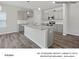 Modern kitchen featuring gray cabinets, granite countertops, and stainless steel appliances at 213 Lake George Dr, Shelby, NC 28152