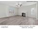 Spacious living room featuring a ceiling fan, optional fireplace, and abundant natural light at 213 Lake George Dr, Shelby, NC 28152