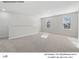 Spacious loft area featuring neutral carpet, two windows with natural light, and white walls at 213 Lake George Dr, Shelby, NC 28152