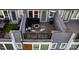 Aerial view of townhomes with rooftop patios featuring outdoor seating and fire pits at 2306 Elizabeth Mill Pl, Charlotte, NC 28208