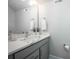 The bathroom features a gray vanity with white countertop, modern fixtures, and a large mirror at 2306 Elizabeth Mill Pl, Charlotte, NC 28208