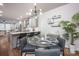 Bright dining area with modern lighting, elegant glass table, and a view into kitchen at 2306 Elizabeth Mill Pl, Charlotte, NC 28208