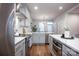 Spacious kitchen featuring stainless steel appliances, granite counters and hardwood floors at 2306 Elizabeth Mill Pl, Charlotte, NC 28208