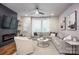 Open living room with hardwood floors, a ceiling fan and lots of natural light at 2306 Elizabeth Mill Pl, Charlotte, NC 28208