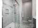 Clean and modern shower with white marble tile and glass door enclosure at 2306 Elizabeth Mill Pl, Charlotte, NC 28208