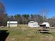 Large backyard with storage sheds and a picnic table at 2318 W Main St, Albemarle, NC 28001