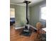Cozy living room featuring a wood-burning stove and natural light at 2318 W Main St, Albemarle, NC 28001