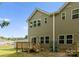 Exterior view of backyard featuring a wooden deck and a two-story home with vinyl siding and ample windows at 2825 New Pineola Rd # 7A, Charlotte, NC 28208