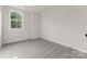 A carpeted bedroom has natural light streaming through the window at 2825 New Pineola Rd # 7A, Charlotte, NC 28208