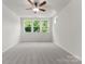 A sun-filled bedroom with three windows and a ceiling fan at 2825 New Pineola Rd # 7A, Charlotte, NC 28208