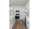 Kitchen featuring stainless steel appliances, white cabinets, and modern design at 2825 New Pineola Rd # 7A, Charlotte, NC 28208