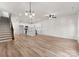 Spacious open floor plan with white walls, lots of natural light, wood flooring and a staircase at 2825 New Pineola Rd # 7A, Charlotte, NC 28208