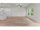Bright and airy living room featuring kitchen, large windows for ample light and sleek ceiling fan at 2825 New Pineola Rd # 7A, Charlotte, NC 28208