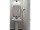 A powder room with modern fixtures and a pedestal sink for guests at 2825 New Pineola Rd # 7A, Charlotte, NC 28208