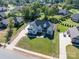 Aerial view of a landscaped yard, long driveway and beautiful home at 329 Wintergreen Ct, Kings Mountain, NC 28086