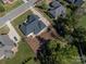 Aerial view of the property showing landscaped yard, mature trees and neighborhood at 329 Wintergreen Ct, Kings Mountain, NC 28086