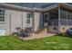 Back patio with outdoor table, chairs and access to screened in porch at 329 Wintergreen Ct, Kings Mountain, NC 28086