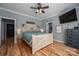 Charming bedroom featuring rustic wood bedframe, hardwood floors, and ample space at 329 Wintergreen Ct, Kings Mountain, NC 28086