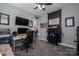 Functional bedroom with a desk, TV, wall decorations, and convenient access to the hall at 329 Wintergreen Ct, Kings Mountain, NC 28086