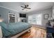 Comfortable bedroom with hardwood floors, ceiling fan, and natural light at 329 Wintergreen Ct, Kings Mountain, NC 28086