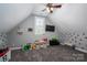 Bright bedroom with a ceiling fan, a window, and a TV, perfect for children or a play area at 329 Wintergreen Ct, Kings Mountain, NC 28086
