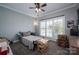Bedroom with gray carpet and a sitting chair near a large window at 329 Wintergreen Ct, Kings Mountain, NC 28086