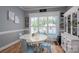 Cozy dining area with a round table, cottage-style chairs, and natural light, creating a welcoming atmosphere at 329 Wintergreen Ct, Kings Mountain, NC 28086