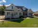 Charming one-story brick home with a perfectly manicured lawn, and quaint covered front porch at 329 Wintergreen Ct, Kings Mountain, NC 28086
