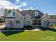 Stunning single-story home with brick facade, mature landscaping, and a welcoming front porch at 329 Wintergreen Ct, Kings Mountain, NC 28086