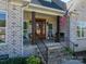 Charming front porch with brick stairs, railings and a lovely seating area at 329 Wintergreen Ct, Kings Mountain, NC 28086