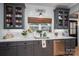 Well-lit kitchen with stainless steel appliances, quartz countertops, and farmhouse-style accents at 329 Wintergreen Ct, Kings Mountain, NC 28086