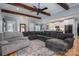 Spacious living room with hardwood floors, exposed beams, and a comfortable sectional sofa, great for entertaining at 329 Wintergreen Ct, Kings Mountain, NC 28086