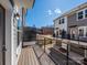 Spacious wooden balcony with black metal railings, offering neighborhood views at 3928 Craig Ave, Charlotte, NC 28211