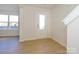 Bright entryway featuring hardwood floors, neutral walls, and lots of natural light at 3928 Craig Ave, Charlotte, NC 28211