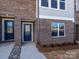 Inviting townhome exterior with brick facade, private entryways, and well-maintained landscaping at 3928 Craig Ave, Charlotte, NC 28211