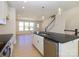 Bright kitchen with stainless steel appliances and a view into the adjacent living area at 3928 Craig Ave, Charlotte, NC 28211