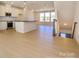 Open kitchen with hardwood floors, stainless steel appliances, and island with seating at 3928 Craig Ave, Charlotte, NC 28211