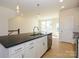 Modern kitchen island featuring stainless steel appliances and pendant lighting at 3928 Craig Ave, Charlotte, NC 28211