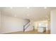 Spacious living area with stairs, recessed lights, and kitchen with a large island at 3928 Craig Ave, Charlotte, NC 28211