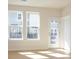 Bright living space with hardwood floors, large windows, and access to a patio at 3928 Craig Ave, Charlotte, NC 28211