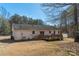 Spacious backyard features a wooden deck with an attached shed and a large propane tank nearby at 4175 Barnell Ln, Maiden, NC 28650