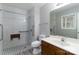 Bathroom with a tiled shower featuring safety bars and a fold-down seat at 4175 Barnell Ln, Maiden, NC 28650