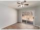 Bedroom with a ceiling fan and sliding glass door leading to a deck, offering a seamless indoor-outdoor flow at 4175 Barnell Ln, Maiden, NC 28650