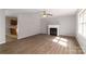 Inviting living room featuring a fireplace and vinyl plank flooring at 4175 Barnell Ln, Maiden, NC 28650
