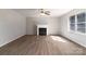 Cozy living room with a charming fireplace and large window at 4175 Barnell Ln, Maiden, NC 28650