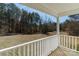 Serene view from the covered porch overlooking the expansive front yard and surrounding greenery at 4175 Barnell Ln, Maiden, NC 28650