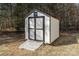 Exterior shot of a shed in the backyard featuring black and white trim with a wooden ramp at 4175 Barnell Ln, Maiden, NC 28650